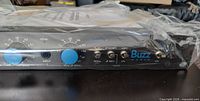 Front panel of Buzz Audio SSA-1.1 amplifier wrapped in factory plastic