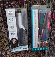 Both boxed Conair styling tools side by side