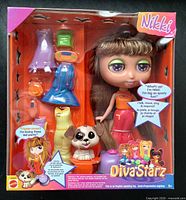 Front of sealed Nikki Diva Starz doll package showing doll, dog figure and accessories