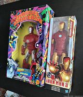 Two boxed Iron Man action figures side by side