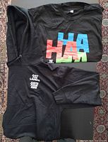 T-shirt and hoodie laid out together showing graphics
