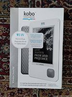 Front of sealed Kobo eReader WiFi box showing product image and features