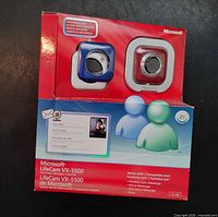 Front of sealed Microsoft LifeCam VX-5500 retail package showing webcam and extra faceplates