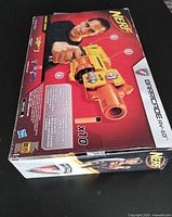 Front of sealed Nerf Barricade RV-10 box showing blaster and x10 darts