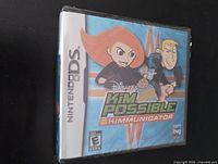 Front view of sealed Nintendo DS "Kim Possible: Kimmunicator" game case