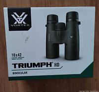 Retail box showing Vortex Triumph HD 10x42 binocular image and branding