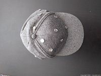 Top view of gray rhinestone-studded cap showing crown and brim