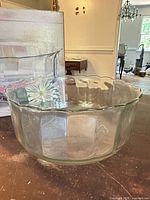 Top angled view of the clear scalloped glass serving bowl
