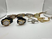 Group shot of all nine wrist watches