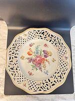 Top view showing floral painting and reticulated rim
