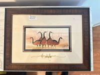 Full view of framed print showing frame, mat and artwork