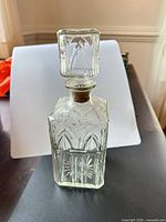 Full view of decanter front showing pattern and stopper