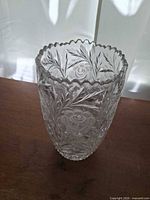 Angled view of full vase showing cut pattern and shape