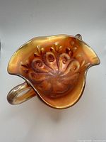 Top view showing interior swirl beaded pattern and iridescent finish