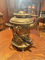 Complete brass kettle assembly on stand