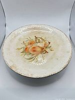 Top view showing peach design, rim and overall wear