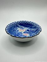 Side view of blue and white porcelain floral bowl