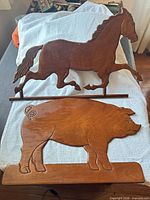 Front view of both wooden silhouettes