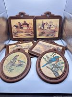 All six plaques grouped to show quantity, mix of rectangular and oval frames, farm and bird imagery visible