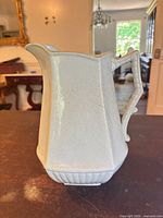 Full view of white ironstone pitcher showing overall shape and glaze