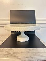 side profile of cake stand showing hobnail pattern and pedestal