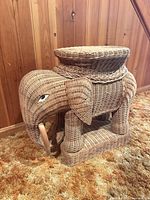 Front angled view of wicker elephant side table