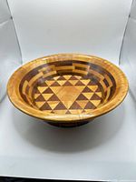 Top view showing geometric segmented wood pattern inside bowl