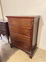 Full view of dresser front showing four drawers and hardware