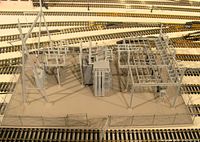 Overhead view of entire HO scale substation on base surrounded by tracks