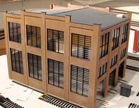 Perspective view of brown brick HO engine house building