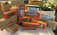 Group shot of all 16 Lionel boxes showing range of styles and sizes
