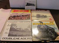 Group shot of four 12-inch LPs and one 7-inch EP showing covers and overall condition