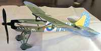 Full side view of olive green Lyonaeec FW.56A-1 rubber-band powered airplane
