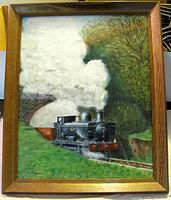Frontal view of framed oil painting showing steam locomotive and signature
