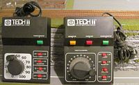 Front view of both Tech II Loco-Motion controllers showing model numbers 1500 and 2500 and control layouts
