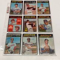 Fronts of nine 1971 O-Pee-Chee baseball cards in plastic page