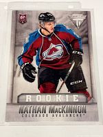 Front view of Nathan MacKinnon 5x7 Jumbo Rookie card in sleeve