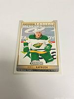 Front of Kirill Kaprizov League Leaders rookie points insert card