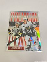 Front of Connor Bedard Premium Player parallel card in sleeve