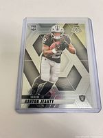 Front view of the sleeved and top-loaded 2025 Panini Mosaic Ashton Jeanty rookie card
