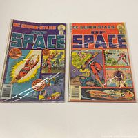 Front covers of both comics in bags