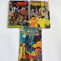 Front covers of all three comic books displayed