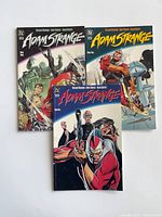 Front covers of all three Adam Strange prestige issues