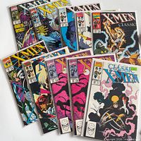 All ten bagged comics fanned out showing covers