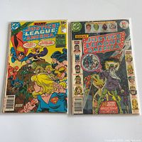 Front covers of both bagged comics side by side