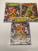 Group shot of three Beware the Creeper issues (#2 x2, #4) in bags