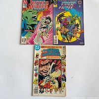 Front covers of all three comic books