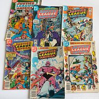 Front covers of all six Justice League of America comics laid out.