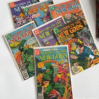 All seven bagged Return of the New Gods issues fanned out