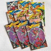 All nine X-Force comics fanned out showing covers